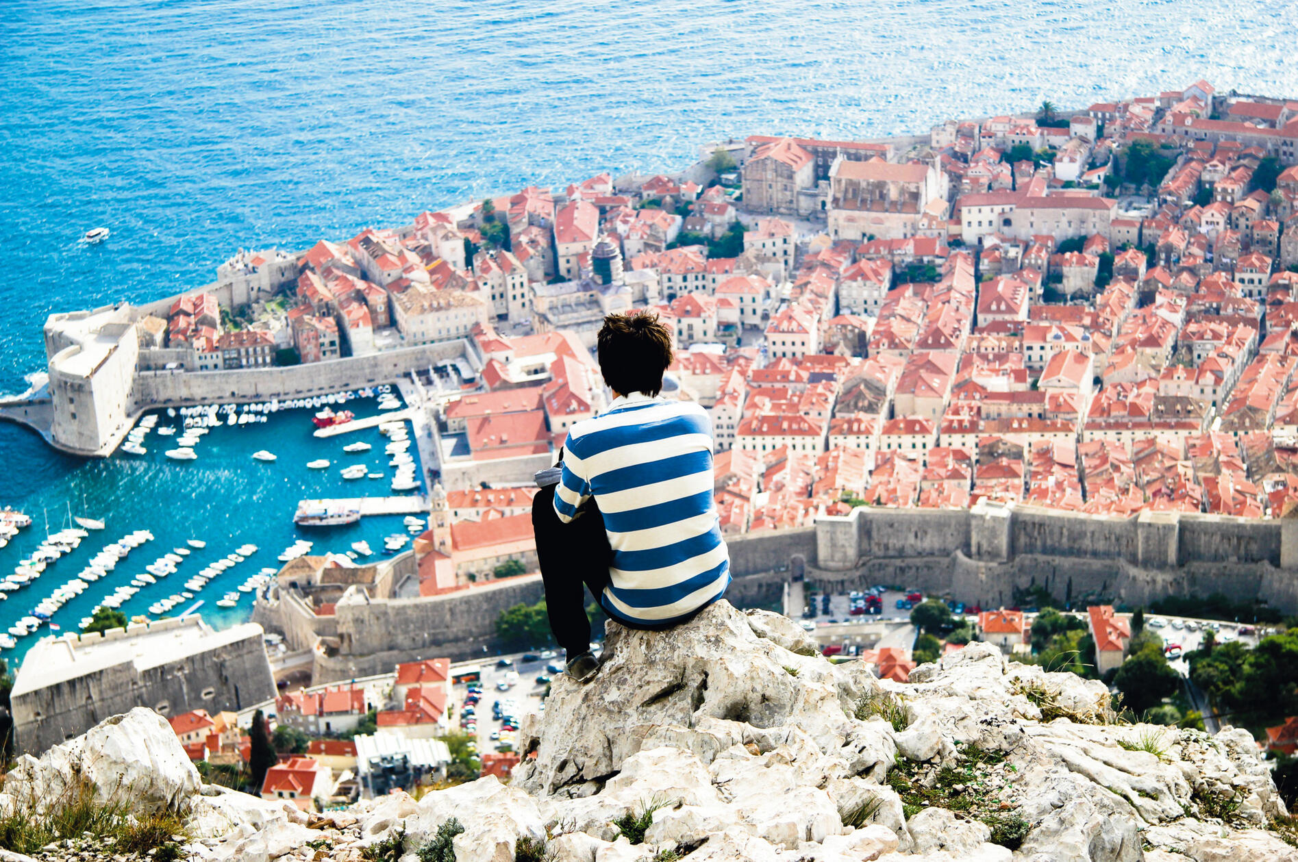 A young man overlooks the old town of Dubrovnik from Mount Srđ. Top 10 Finalist, The Walrus Amateur Travel Photography Contest, 2011